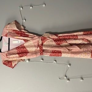 Francesca’s NWT pink patch work wrap dress